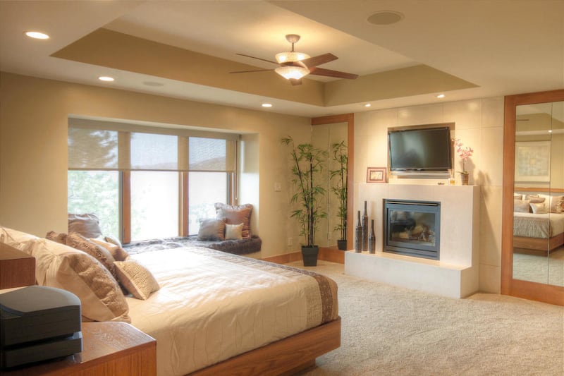 The tray ceiling in this master bedroom makes the room feel more spacious while adding drama to the room.