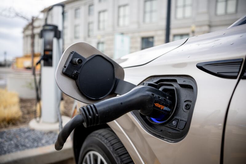 An electric vehicle charges at a charging station at the Capitol in Salt Lake City.
