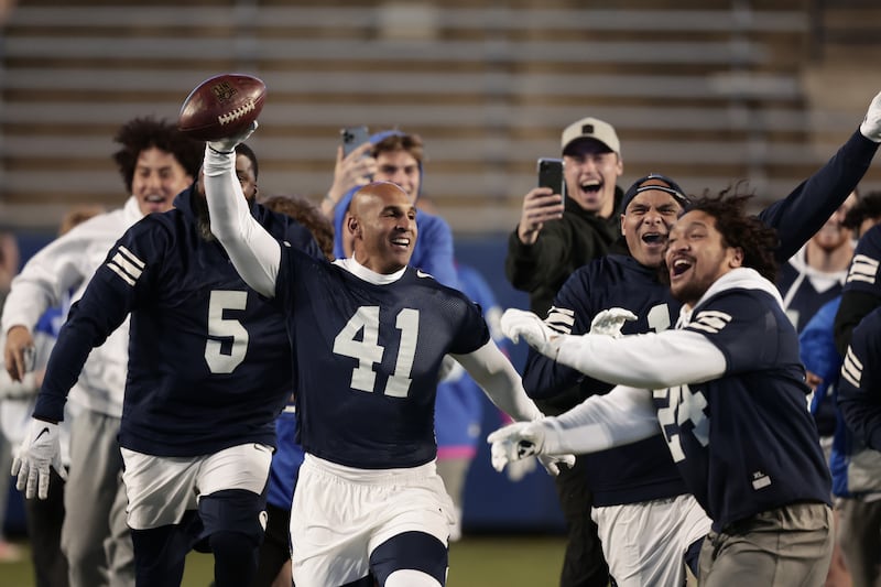 BYU’s Bryan Kehl celebrates his game-winning TD catch in BYU’s alumni game last Thursday at LaVell Edwards Stadium in Provo.