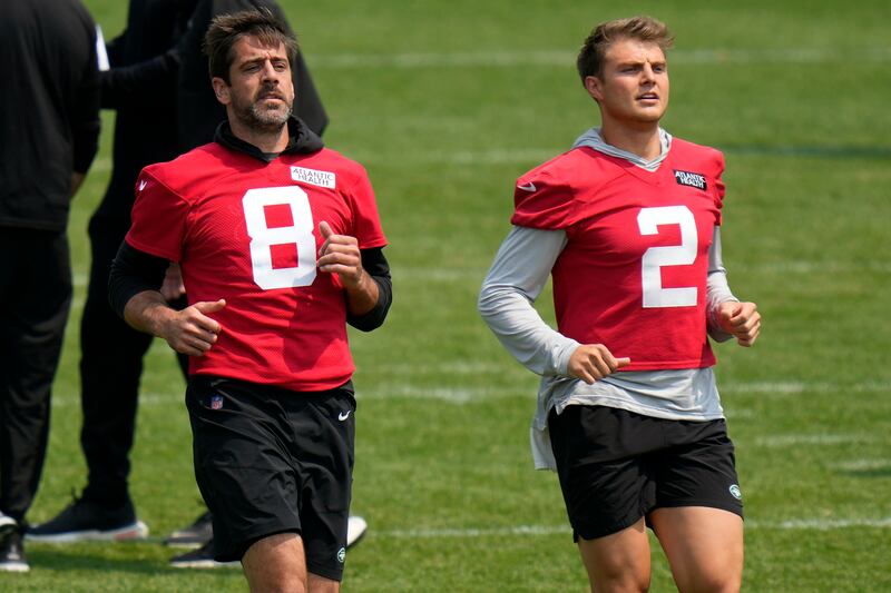 New York Jets quarterbacks Aaron Rodgers and Zach Wilson warm up at the NFL team’s training facility.