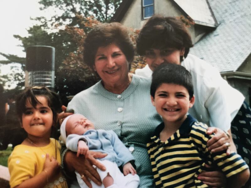 A younger Parideh Berenji Abramian (center) poses with her daughter Jackie and her grandchildren, Anais, Artin and Craig. Now 86, Abramian is still a force, capable of fixing broken appliances and driving younger friends to their appointments.
