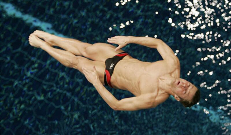 Justin Wilcock is laid out above the water at Friday's U.S. Olympic Diving Trials.