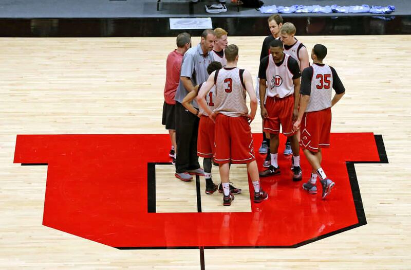 Utah Utes head coach Larry Krystkowiak talks to some of his players during the University of Utah's men's basketball practice at the Jon M. Huntsman Center before heading off to play Duke University in the Sweet 16 in Houston, Monday, March 23, 2015, in S