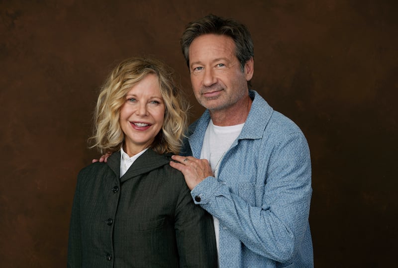 Actor-director Meg Ryan, left, poses with co-star David Duchovny on Oct. 25, 2023, to promote their film “What Happens Later.”