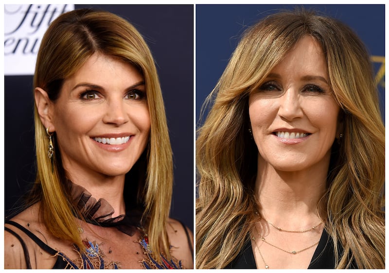 This combination photo shows actress Lori Loughlin at the Women's Cancer Research Fund's An Unforgettable Evening event in Beverly Hills, Calif., on Feb. 27, 2018, left, and actress Felicity Huffman at the 70th Primetime Emmy Awards in Los Angeles on  Sep