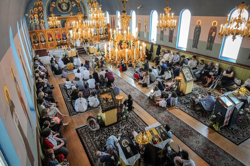 Parishioners listen to Father Justin Havens inside of Saints Peter and Paul Orthodox Church on 355 S. 300 E. in downtown Salt Lake on Sunday, April 22, 2018. The church is planning on building a new building and are trying to find funding, but having a di
