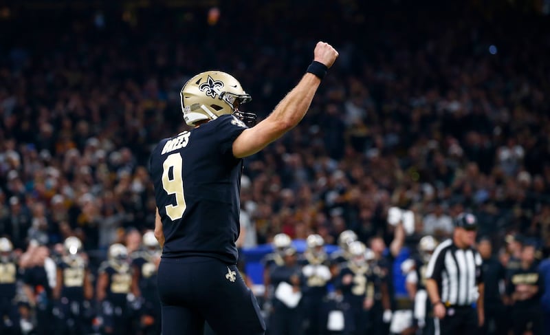 New Orleans Saints quarterback Drew Brees (9) celebrates a touchdown by running back Alvin Kamara, not pictured, in the first half of an NFL football game in New Orleans, Sunday, Dec. 23, 2018. The Saints won 31-28, clinching the top seed for the NFC and