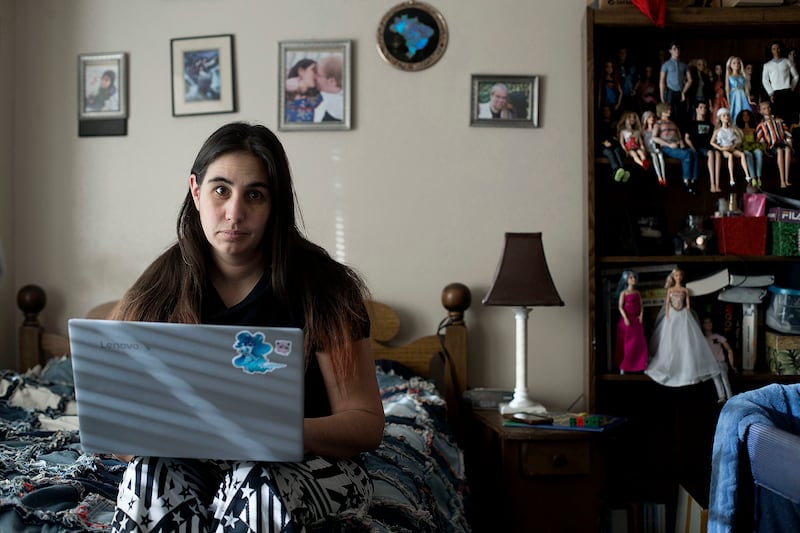 Janci Patterson, a stay-at-home writer, works on her adult romance series called "The Extra" at her home in Orem on Friday, Dec. 14, 2018. Patterson and her co-writer use the Barbie dolls to act out scenes for their books.