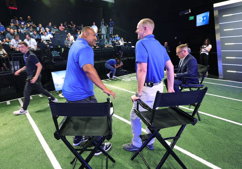 BYU head football coach Kalani Sitake and athletic director Tom Holmoe talk during a broadcasting break during BYU football media day.