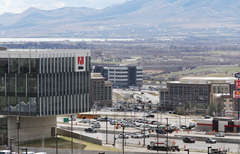 Lehi, Utah, business office buildings with a parking lot and busy roads.