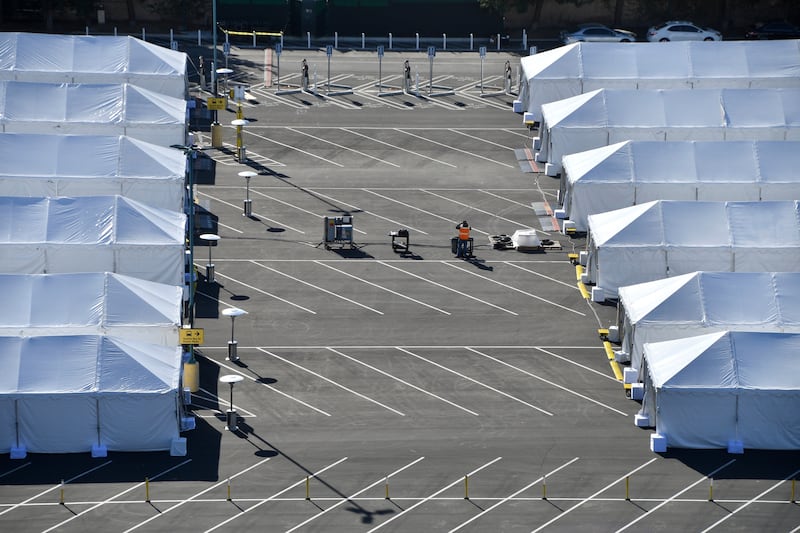 COVID-19 vaccination tents are set up in the north of the Toy Story parking lot at the Disneyland Resort on Tuesday, Jan. 12, 2021, in Anaheim, Calif.