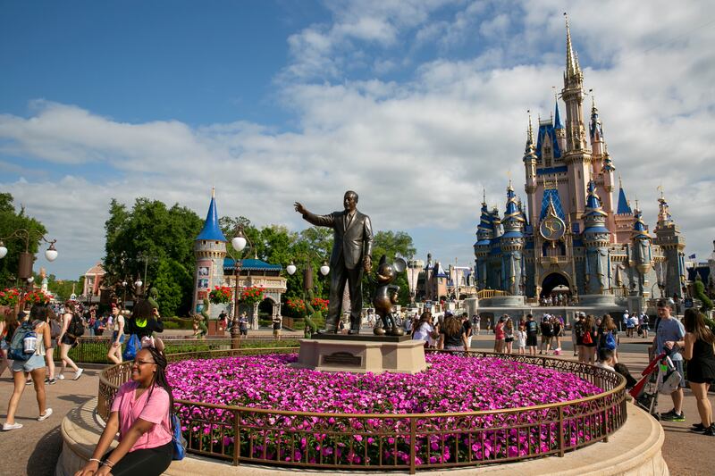 People visit Magic Kingdom Park at Walt Disney World Resort in Lake Buena Vista, Florida.