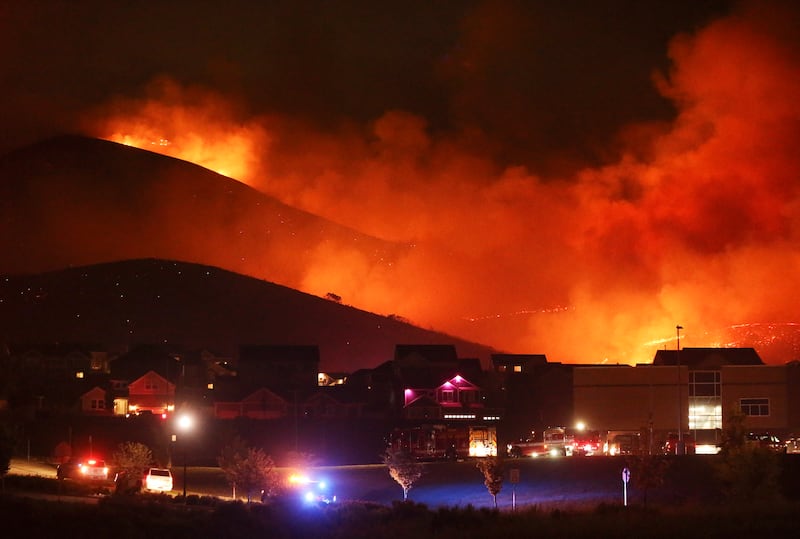 A wildfire on Traverse Mountain threatens homes in Lehi on Sunday, June 28, 2020.