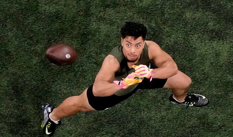 Utah defensive back Sione Vaki catches a ball during the NFL Scouting Combine, Friday, March 1, 2024, in Indianapolis.
