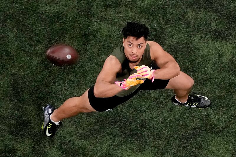 Utah defensive back Sione Vaki catches a ball during the NFL Scouting Combine, Friday, March 1, 2024, in Indianapolis.