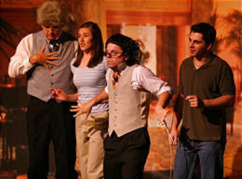 Bride-to-be Gretchen (Liz Christensen) and her fiance, Dax (Christopher Glade, far right), meet with their wedding planners, played by Scott Holman, left, and Dan Larrinaga, in Desert Star Theater's "My Big Fat Utah Wedding."