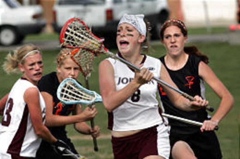 Jordan's Lindsey Mark heads down field as Murray's Emily Brown gives chase during a game Wednesday.