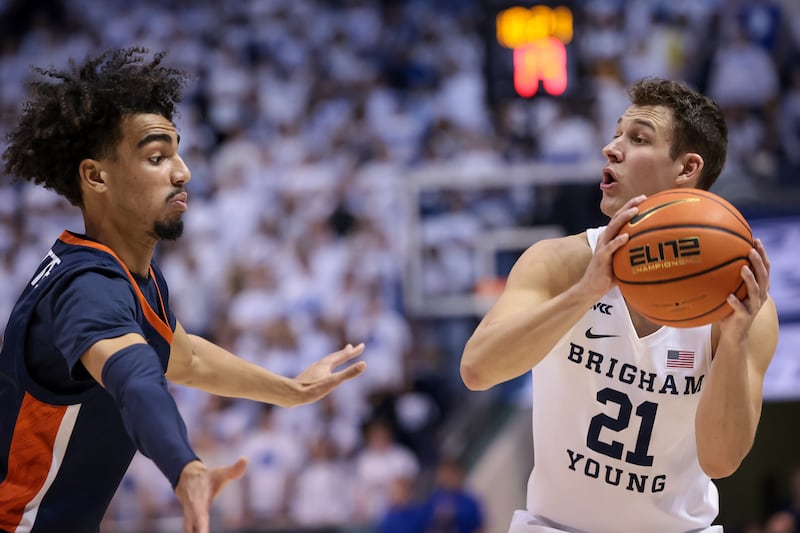Pepperdine Waves guard Houston Mallette (0) defends against Brigham Young Cougars guard Trevin Knell (wearing white)