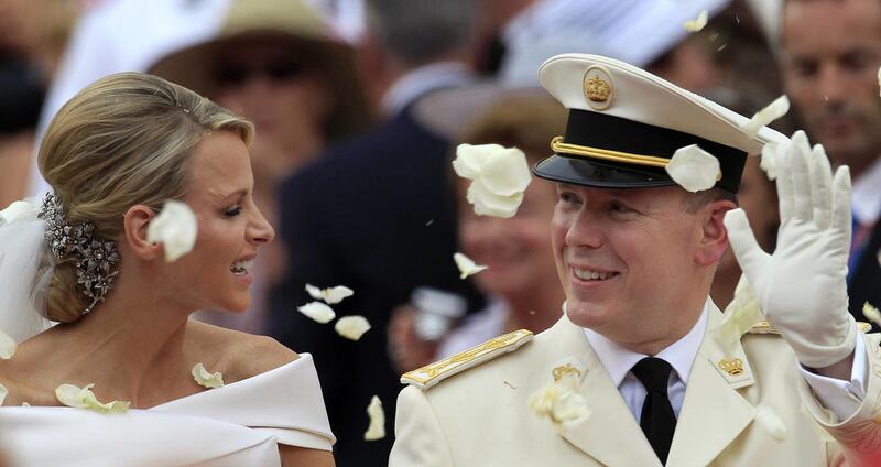 In this Saturday, July 2, 2011 file photo Prince Albert II of Monaco and Princess Charlene of Monaco depart from the Monaco palace after their religious wedding ceremony. Monaco's Princess Charlene has given birth to royal twins, Gabriella and Jacques, We