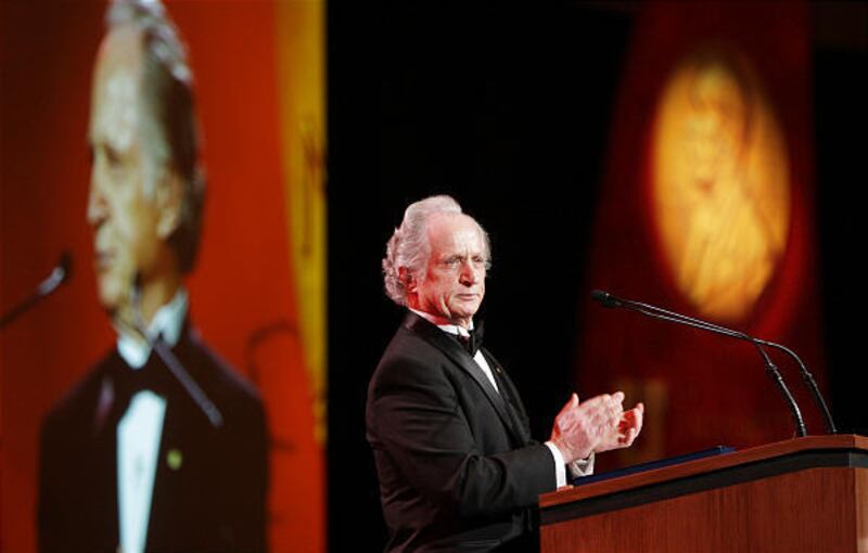 Nobel Prize winner Mario Capecchi addresses friends and colleagues at the Grand America Hotel Saturday night. He answered questions from the crowd and said he hopes to continue studying genetics.