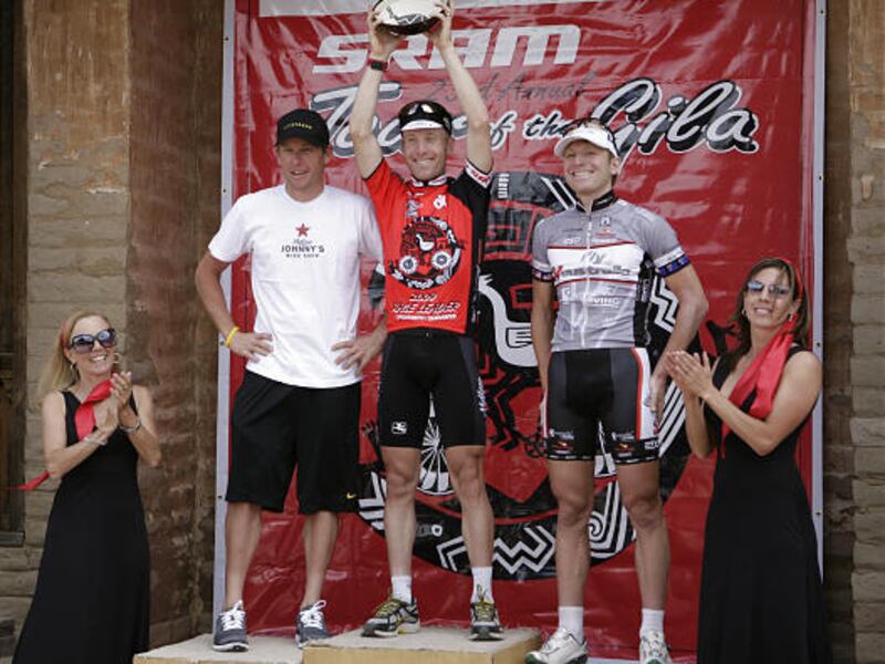 Utah resident Levi Leipheimer, center, holds up the Tour of the Gila winner's trophy. Teammate Lance Armstrong, left, took second.