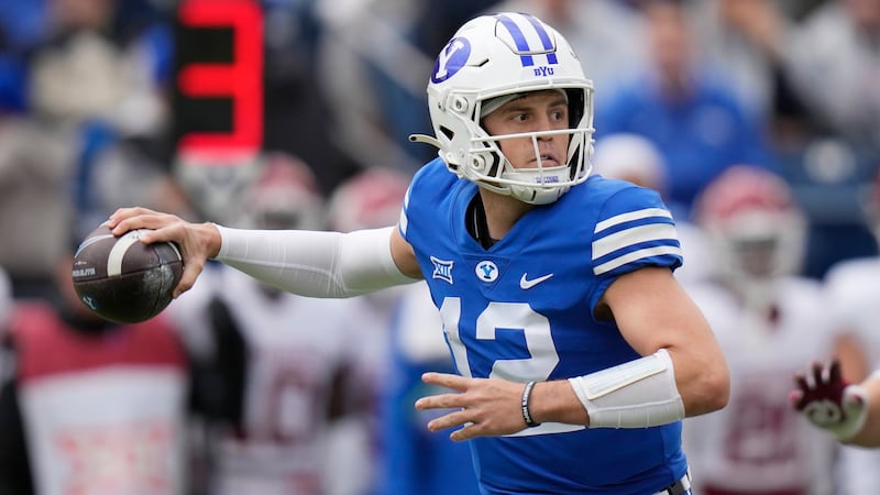 BYU quarterback Jake Retzlaff (12) throws against Oklahoma during the first half of an NCAA college football game Saturday, Nov. 18, 2023, in Provo, Utah. (AP Photo/Rick Bowmer)