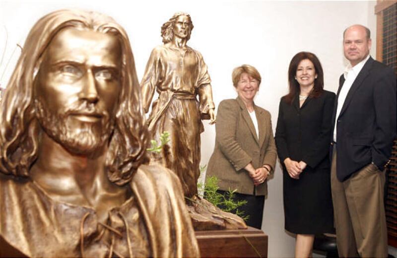 Karen Ashton, left, co-founder of Thanksgiving Point, and Mike Washburn, right, president and CEO of Thanksgiving Point, stand next to sculptor Angela Johnson. Johnson's nonprofit, the I Am the Light of the World Foundation, is working with Thanksgiving P