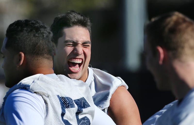 Bronson Kaufusi laughs as BYU practices at UNLV as they prepare to play Utah in the Royal Purple Las Vegas Bowl Wednesday, Dec. 16, 2015.