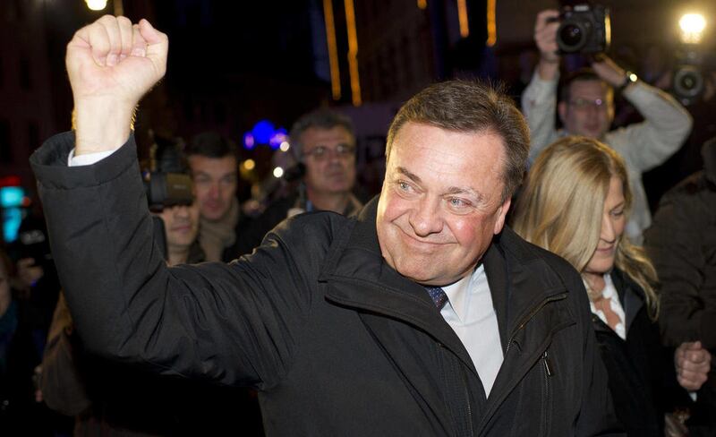 FILE - A Sunday, Dec. 4, 2011 photo from files of Slovenian opposition leader, Zoran Jankovic, celebrating after his parties gains in the country's parliamentary elections. Police say the leader of Slovenia's opposition who is also mayor of the capital Lj