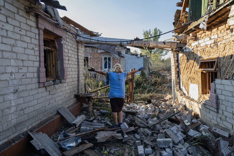 Olena Kononenko, 61 reacts near her damaged house after Russian rocket attack in Kostiantynivka, Ukraine, Sept. 27, 2023.