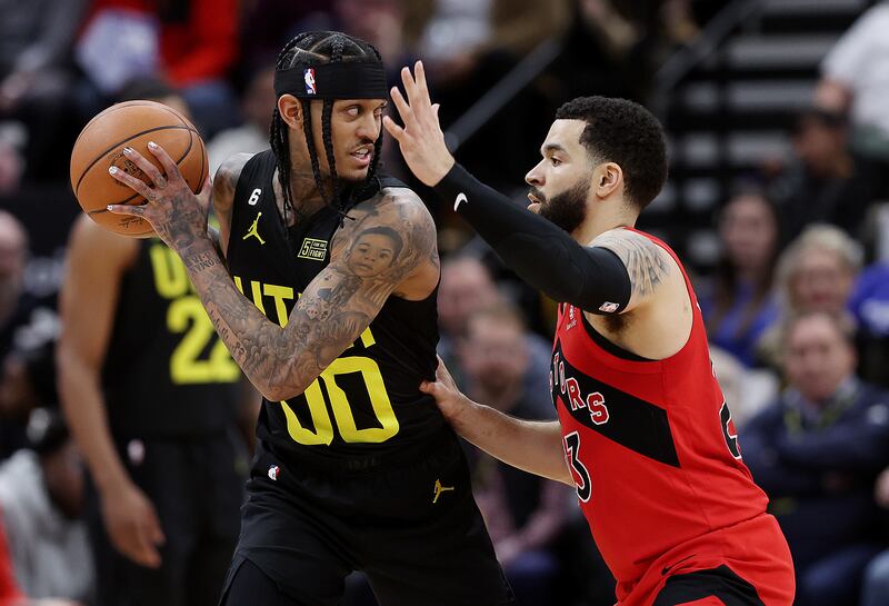 Utah Jazz guard Jordan Clarkson (00) works against Toronto Raptors guard Fred VanVleet at Vivint Arena in Salt Lake City.
