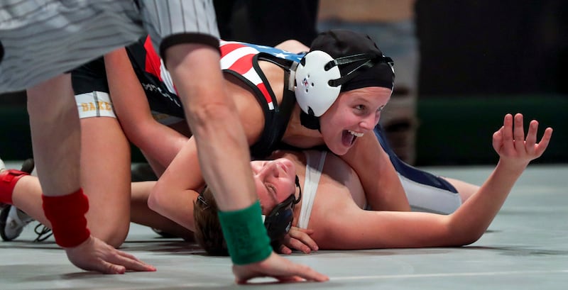 Sage Mortimer, of American Liberty Academy, smiles as she wins by fall over Hector Martinez, of Millard, during the high school wrestling All-Star Dual at the UCCU Center in Orem on Tuesday, Jan. 8, 2019.