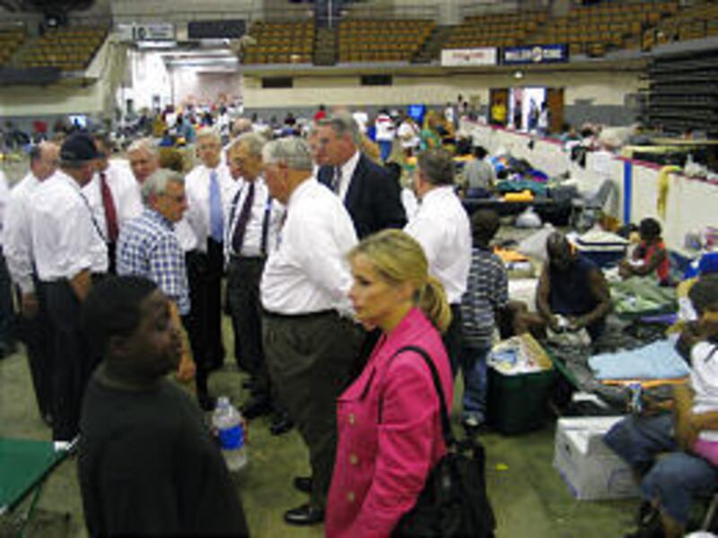 Elder M. Russell Ballard and President Boyd K. Packer visit River Center, which is housing 5,000 evacuees in downtown Baton Rouge.