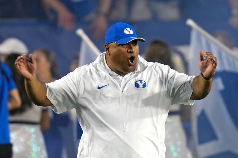 BYU coach Kalani Sitake reacts as he walks on the field before a game between Sam Houston State and BYU.