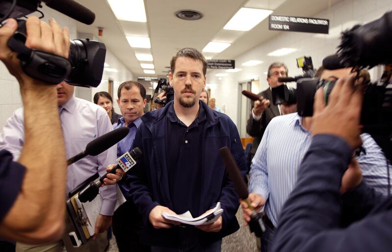 Josh Powell, the husband of missing Utah woman Susan Powell, is surrounded by reporters as he leaves a Pierce County courtroom, Friday, Sept. 23, 2011, in Tacoma, Wash. Powell was attending a hearing regarding a motion for custody of his two children that was filed by his father-in-law, Chuck Cox. (AP Photo/Ted S. Warren)