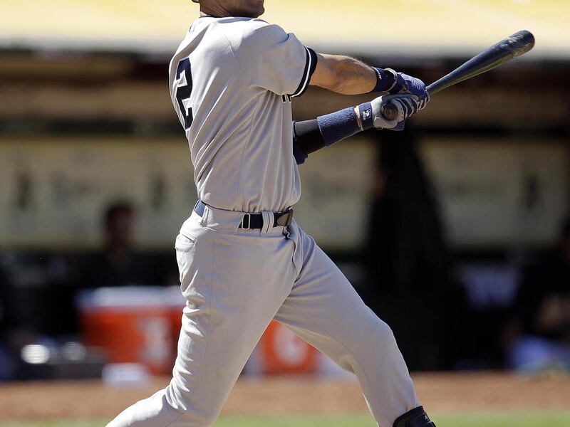 New York Yankees' Derek Jeter fouls off a pitch from Oakland Athletics Brian Fuentes during the ninth inning of a baseball game on Sunday, May 27, 2012, in Oakland, Calif.
