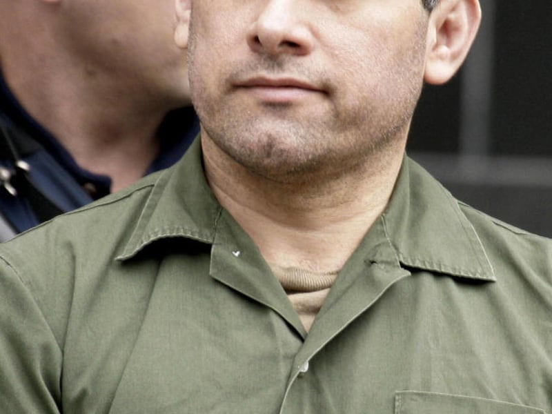 FILE - In a Friday, Feb. 9, 2007 file photo, accused Mexican drug kingpin Osiel Cardenas-Guillen, 39, leaves the federal courthouse in Houston after pleading not guilty to charges connected to running a cartel that at its height smuggled four to six tons