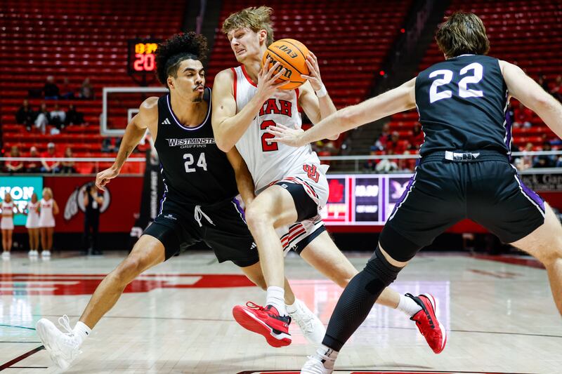 Utah guard Cole Bajema, center, drives through the Westminster defense during an exhibition game at the Huntsman Center in Salt Lake City on Wednesday, Nov. 1, 2023.