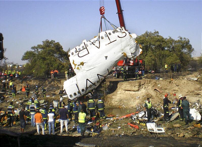 A crane lifts a piece of wreckage from a Spanair airliner bound for the Canary Islands that crashed on takeoff from Madrid. Investigators have ruled out foul play in the crash, according to Spain Development Minister Magdalena Alvarez.