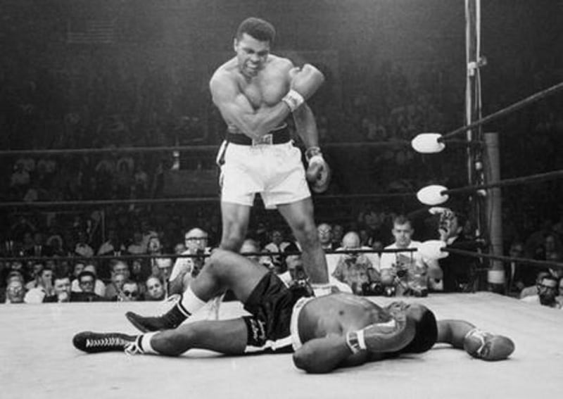FILE - In this May 25, 1965, file photo, heavyweight champion Muhammad Ali, then known as Cassius Clay, stands over challenger Sonny Liston, shouting and gesturing shortly after dropping Liston with a short hard right to the jaw, in Lewiston, Maine. Ali,