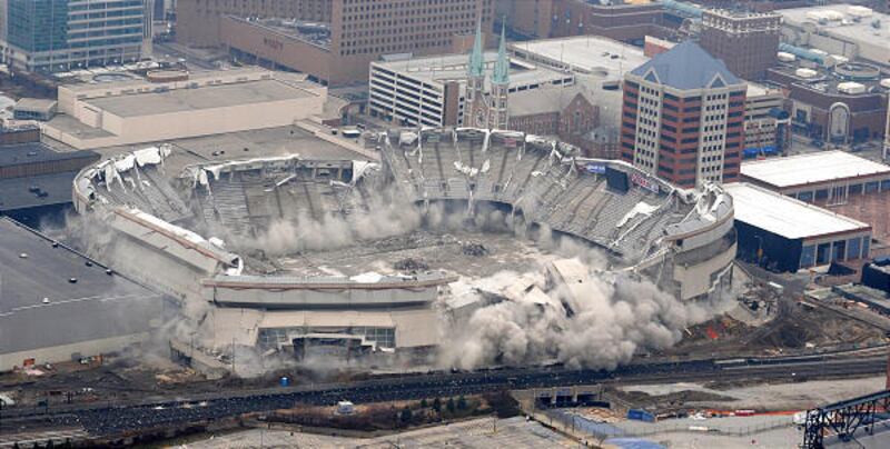 The RCA Dome in downtown Indianapolis falls into rubble after imploding on Saturday, making way for an expanded convention center.