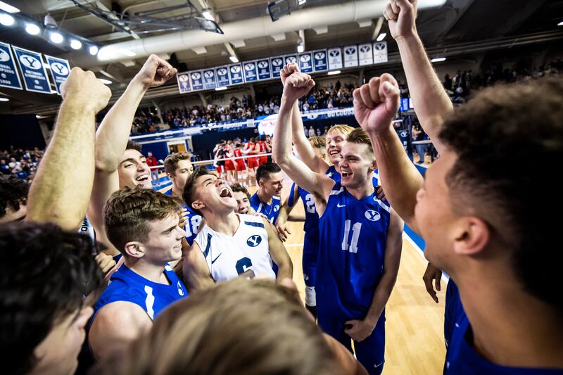 The BYU men’s volleyball team celebrates during its match against Lewis on Saturday, January 7, 2023 at Smith Fieldhouse in Provo, Utah. The Cougars swept Fairleigh Dickinson on Saturday.