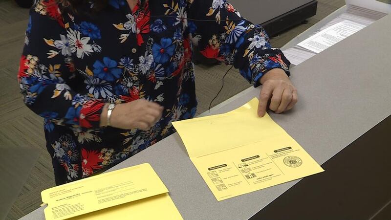 Sanpete County Clerk Sandy Neill displays a correctly printed ballot envelope and one missing the voter affidavit and signature line due to a printing error on Wednesday, Oct. 14, 2020.