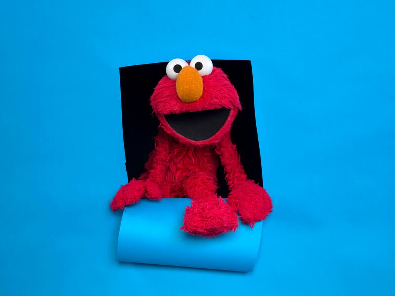 In this Jan. 24, 2011, file photo, Elmo of the film “Being Elmo” poses for a portrait in the Fender Music Lodge during the 2011 Sundance Film Festival in Park City, Utah.