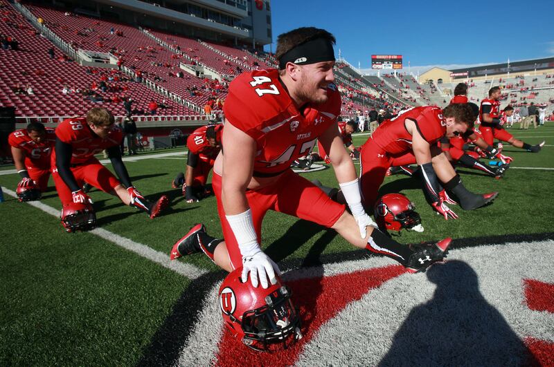 Utah linebacker Alex Whittingham (47) stretches before a game against Colorado at Rice-Eccles Stadium in Salt Lake City.