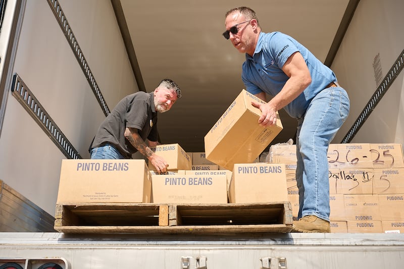 Volunteers help unload boxes from the food donation made by The Church of Jesus Christ of Latter-day Saints to Joe's Pantry in Dallas, Texas, on Thursday, May 14, 2026.