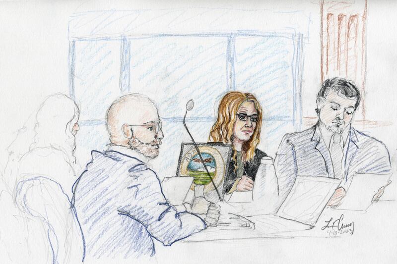 This courtroom sketch, from left, depicts Madison County prosecutor Rob Wood, Lori Vallow Daybell and defense attorney Jim Archibald during opening statements of Vallow Daybell’s murder trial in Boise.