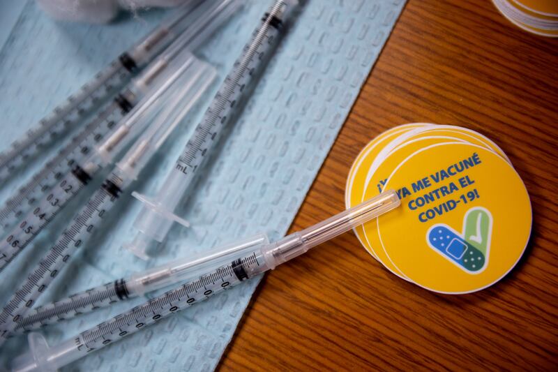 Syringes and stickers are pictured during a vaccination event at the Central Davis Senior Activity Center in Kaysville on Tuesday, July 6, 2021.