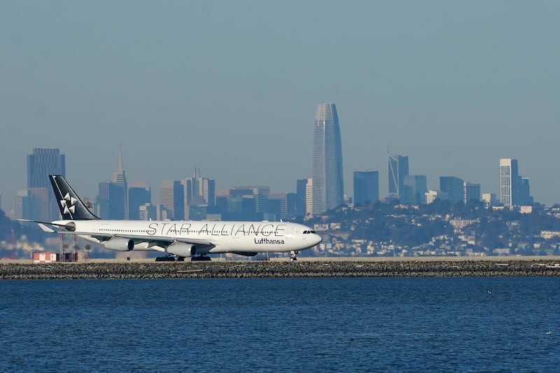A Lufthansa Star Alliance plane prepares to take off at San Francisco International Airport during the coronavirus pandemic in San Francisco, Tuesday, Dec. 22, 2020.