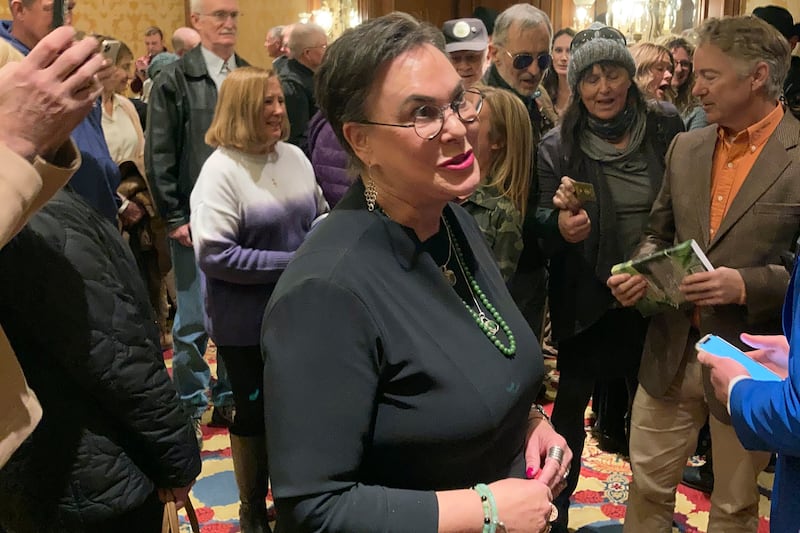 GOP U.S. House candidate Harriet Hageman talks to a supporter at a campaign event on Monday, March 7, 2022, in Cheyenne, Wyo.